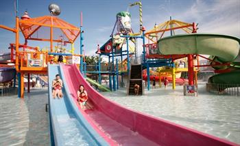 Family plays professor's water playground in Wild Wild Wet water theme park Singapore