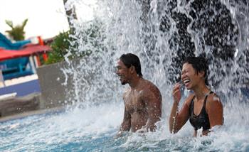 Couple enjoys Jacuzzi at Wild Wild Wet water theme park Singapore