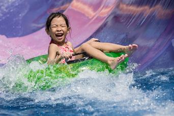 A girl enjoys kidz zone - kiddie amusement and water park in Wild Wild Wet Singapore