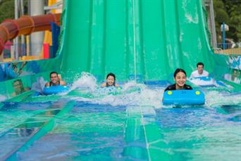A group enjoys Kraken racers giant water slides at Wild Wild Wet water park Singapore