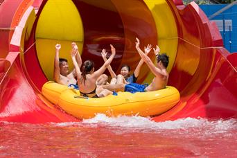 A group plays royal flush extreme water raft ride in Wild Wild Wet water theme park Singapore