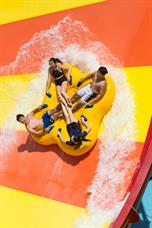 A group plays royal flush water raft ride in Wild Wild Wet water theme park Singapore