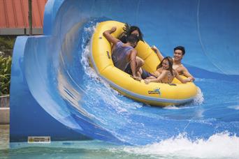 A group enjoys ular lah splash water ride in Wild Wild Wet water theme park Singapore