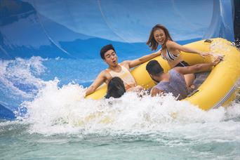 Group plays ular lah white water rafting ride at Wild Wild Wet water park Singapore